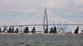 The Melges 24 fleet beats upwind with the Arthur Ravenel Jr. Bridge in the background on Sunday - 2021 Charleston Race Week © Willy Keyworth