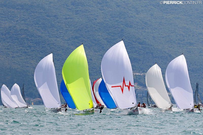 The rhythm of the first day of racing in Riva del Garda was set by a warm Ora blowing from the South around 10 knots photo copyright Pierrick Contin taken at Fraglia Vela Riva and featuring the Melges 24 class