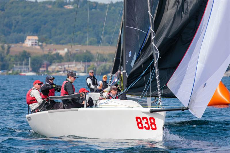 Kevin Welch' s MiKEY with Jeff Madrigali at the helm celebrated a moderate day winning Race 2 - 2019 Melges 24 North American Championship photo copyright Bill Crawford - Harbor Pictures Company taken at Grand Traverse Yacht Club and featuring the Melges 24 class