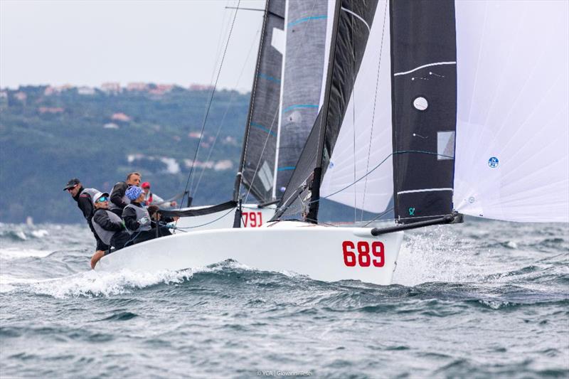 Reigning Melges 24 European Champion Strambapapà, owned & helmed by former Italian Olympian Michele Paoletti, crewing with his wife Giovanna Micol, and their childhood friends' couple of Davide Bivi and Giulia Pignolo along with Than Alexander Herey  photo copyright YCA / Giovanni Tesei taken at Yacht Club Adriaco and featuring the Melges 24 class