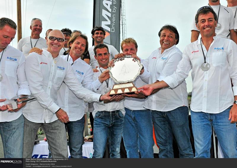 Flavio Favini and Franco Rossini's BluMoon team (SUI825) - Melges 24 European Champions 2013 with the Giorgio Zuccoli's trophy in Medemblik, the Netherlands photo copyright Pierrick Contin taken at  and featuring the Melges 24 class