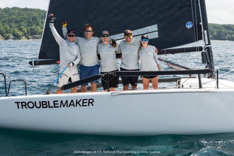 TROUBLEMAKERS, TITLEMAKERS: Eddie Gary and his Troublemaker team celebrate aboard their boat moments after securing the 2026 Corinthian Melges 24 U.S. National Championship on Grand Traverse Bay - photo © Anna Suslova