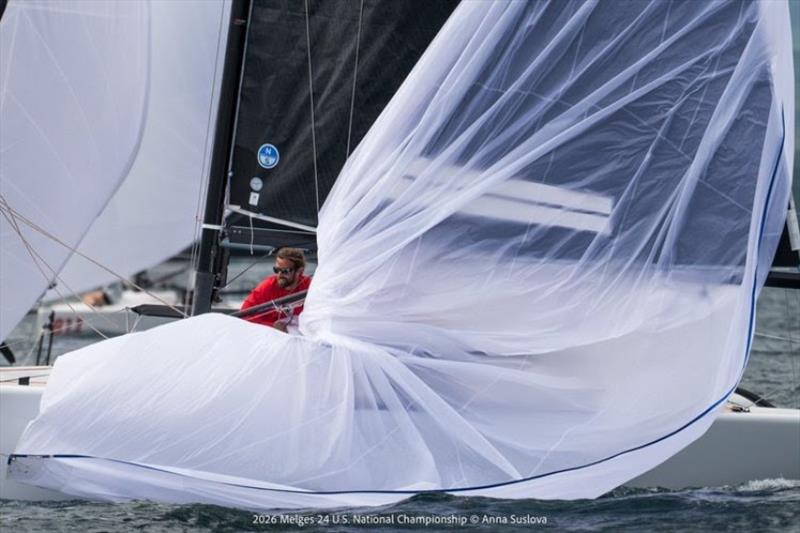 CHOREOGRAPHY IN COLOR: Dick Kalow's Mustang executes the spinnaker douse, as bowman Emory Williams gathers the kite. Its sweeping folds create a moment of artistry amid the intensity of championship racing photo copyright Anna Suslova taken at Grand Traverse Yacht Club and featuring the Melges 24 class