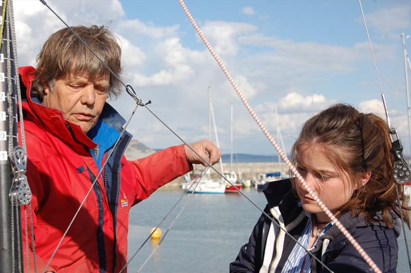 Jon Turner may not have had the easiest entry into dinghy racing, but the natural teacher in him is clearly evident. At Lyme Regis, he is schooling crew Kate into the finer arts of crewing and sometimes complex systems used in a state of the art Merlin - photo © Henshall