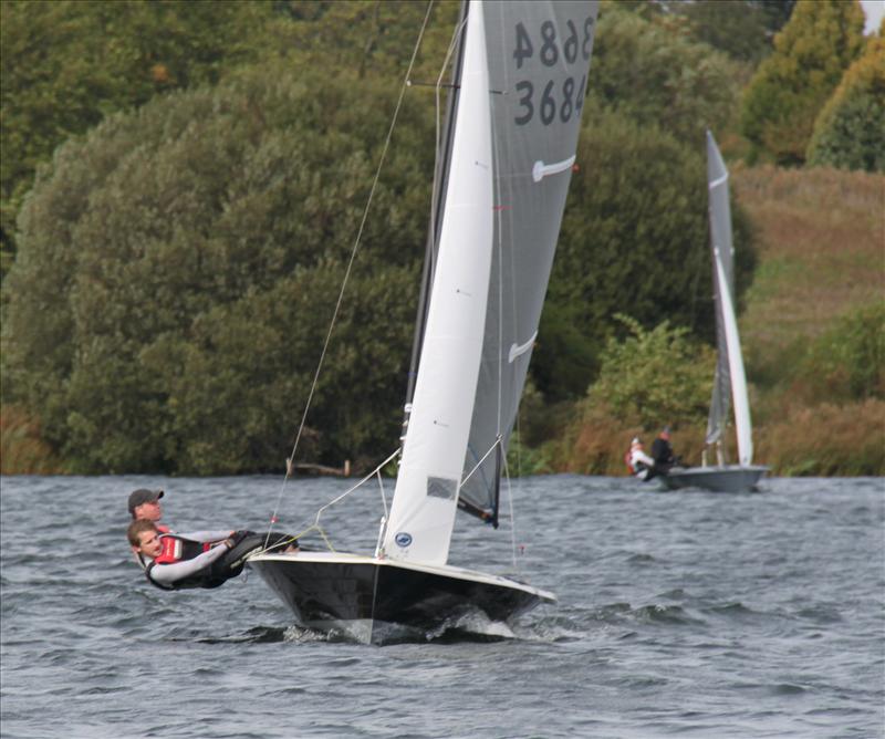 Merlin Rockets race beneath a view of Wembley Stadium photo copyright John McKelvie taken at Wembley Sailing Club and featuring the Merlin Rocket class