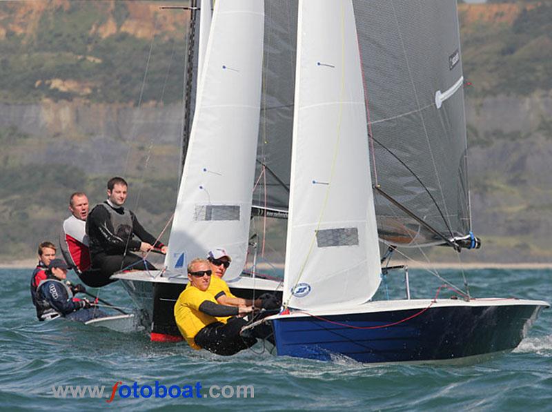 Day 3 of the Merlin Rocket nationals at Lyme Regis photo copyright Mike Rice / www.fotoboat.com taken at Lyme Regis Sailing Club and featuring the Merlin Rocket class