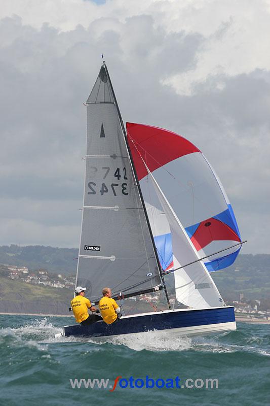 Day 3 of the Merlin Rocket nationals at Lyme Regis photo copyright Mike Rice / www.fotoboat.com taken at Lyme Regis Sailing Club and featuring the Merlin Rocket class