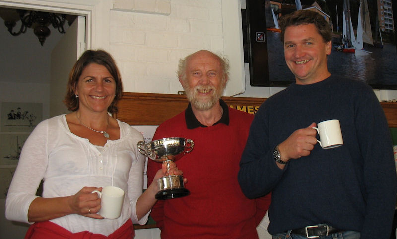 Sara Warren and Andrew Harris receive the Sondown Cup from Tamesis Commodore John Adams photo copyright John Dunkley taken at Tamesis Club and featuring the Merlin Rocket class