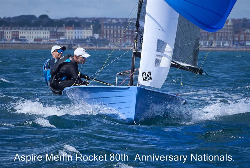 Tom Stewart and Rob Allen power down the reach with the Weymouth seafront behind them on day 5 of the Aspire Merlin Rocket Nationals at the WPNSA - photo © Rob O'Neill