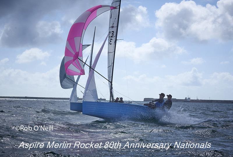 Ben Whaley and Chris Martin blast down the reach with the harbour enterance in the background on day 6 of the Aspire Merlin Rocket Nationals at the WPNSA photo copyright Rob O'Neill taken at Weymouth & Portland National Sailing Academy and featuring the Merlin Rocket class