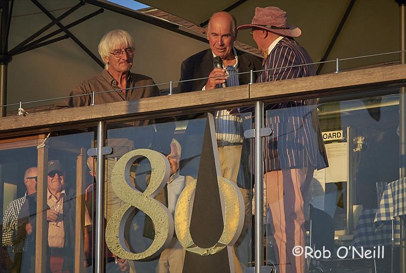 Peter Scott hands Pat Blake the microphone for a few words - Merlin Rocket 80th Anniversary - photo © Rob O'Neill