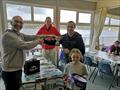 Simon & Lucy Evans receiving the spoils of victory from Delph SC's Commodore Ian Brown © Luke Harrison