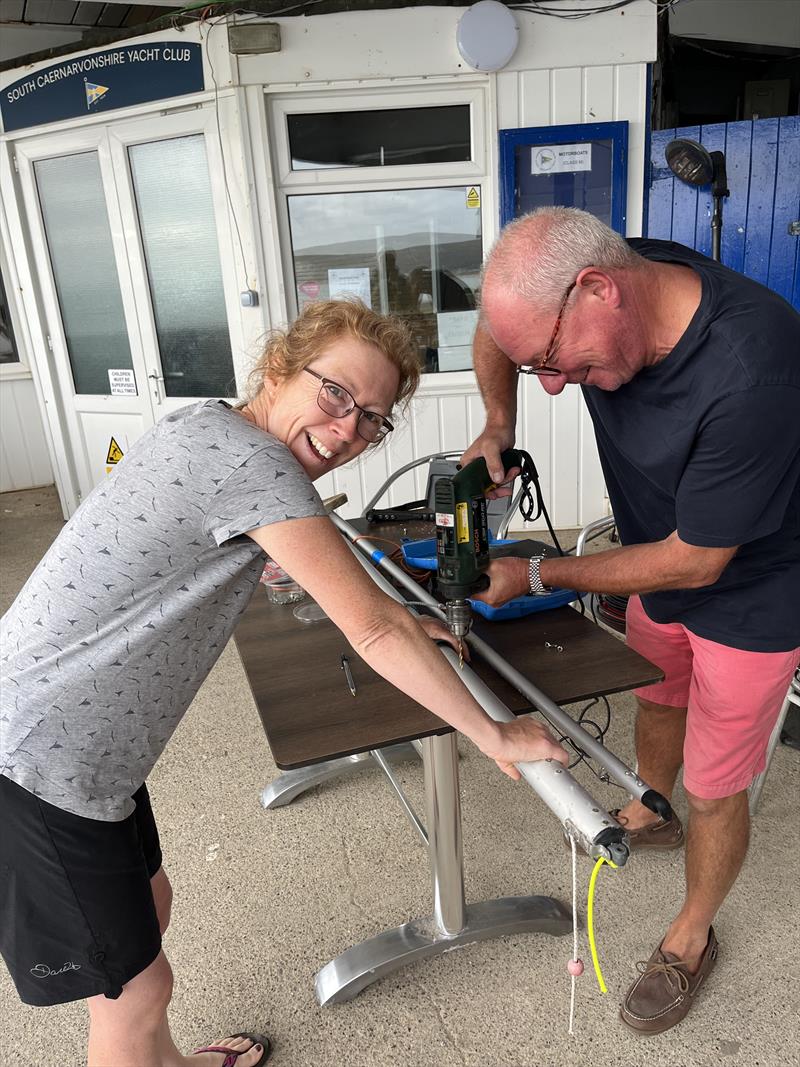 Commodore Nick helping out Natasha Armstrong during Abersoch Mirror Week 2022 photo copyright Mike Crompton taken at South Caernarvonshire Yacht Club and featuring the Mirror class