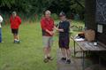 Club Captain Tom Harris presents the Colemere Sailing Club Grand Prix trophy to Nick Edmunds © Steve Murphy