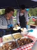 Former MP Edwina Currie informally helped out with catering duties at Toddbrook SC's official clubhouse opening © TSC