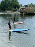 Freddie Sunderland & Stella Nygard paddleboarding at Olton Mere © Jane Sunderland