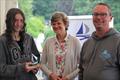 Third overall Medway YC's Millie Lewis with Medway YC's rear commodore Catherine Gore and KSSA's Commodore Andrew Baker during the KSSA Mid-Summer Regatta at Medway