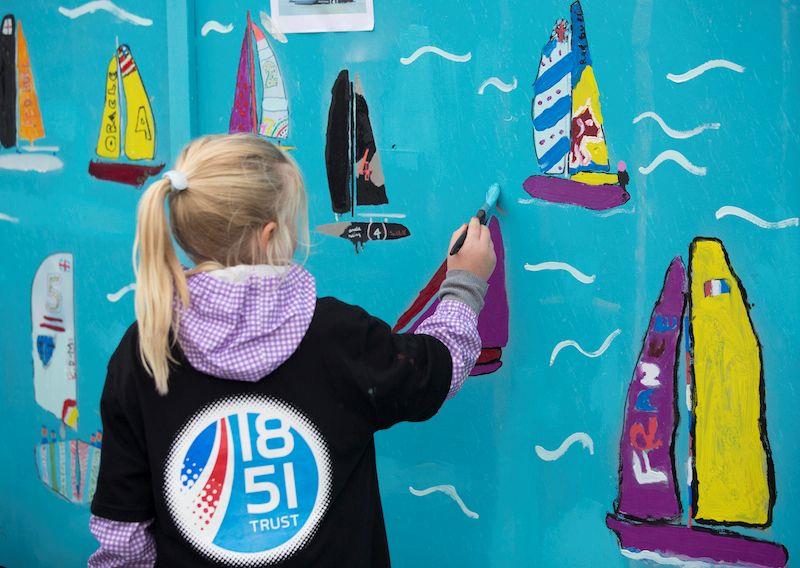 School children pictured painting the walls of the new Ben Ainslie Racing HQ today photo copyright Mark Lloyd / www.lloydimages.com taken at 
