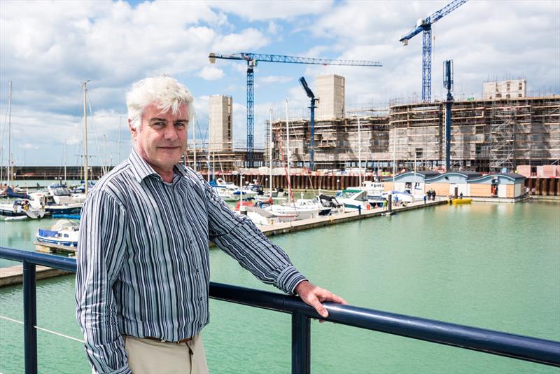 Commodore Phil Thomas of BMYC watches as the new Brighton Marina Yacht Club is moved into its permanent home - photo © Julia Claxton