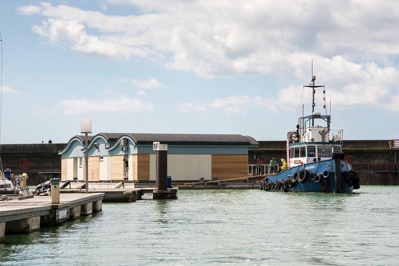 The new Brighton Marina Yacht Club club house heads for its final moorings photo copyright Julia Claxton taken at Brighton Marina Yacht Club