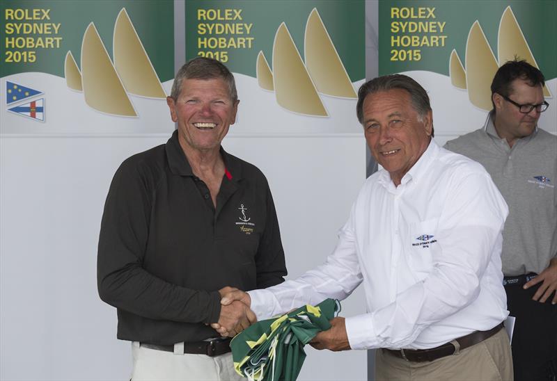 Shane Kearns receives his battle flag from CYCA Commodore John Cameron after the Rolex Sydney Hobart Yacht Race photo copyright Rolex / Stefano Gattini taken at Cruising Yacht Club of Australia