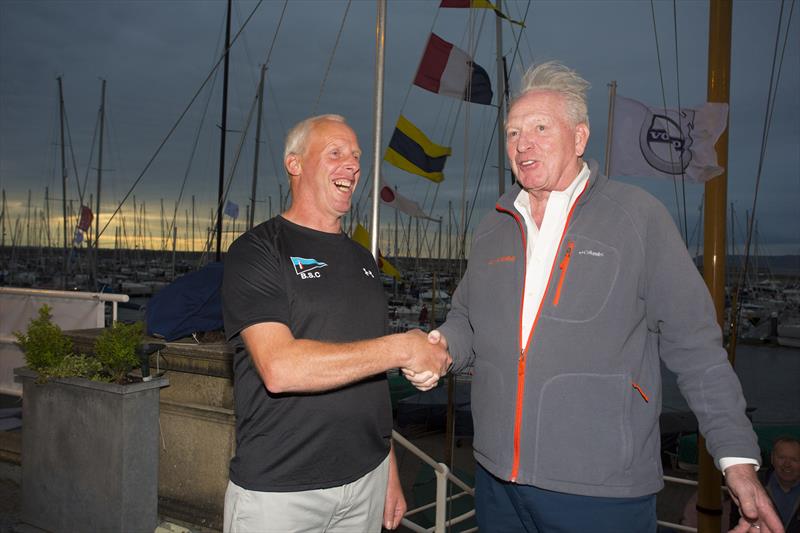 George David, pictured with Pat Collins, one of the Baltimore lifeboat crew, who saved his life after his yacht capsized during the 2011 Fastnet Race photo copyright Michael Kelly taken at Royal Irish Yacht Club