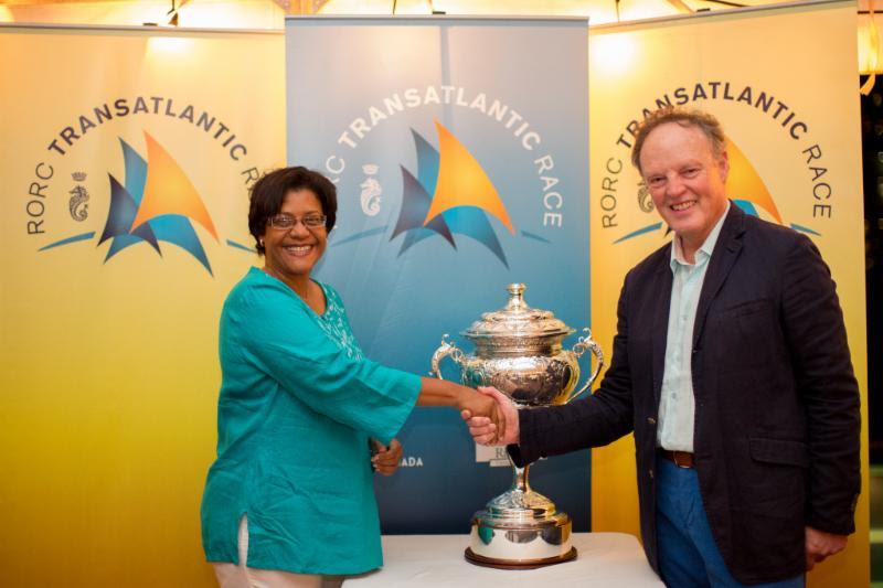 The RORC Transatlantic Race Trophy has pride of place at the final prizegiving where Nikoyan Roberts from the Grenada Tourism Authority (pictured with RORC Commodore, Michael Boyd) pledged their continued support for the race starting on 26th November - photo © Arthur Daniels / RORC