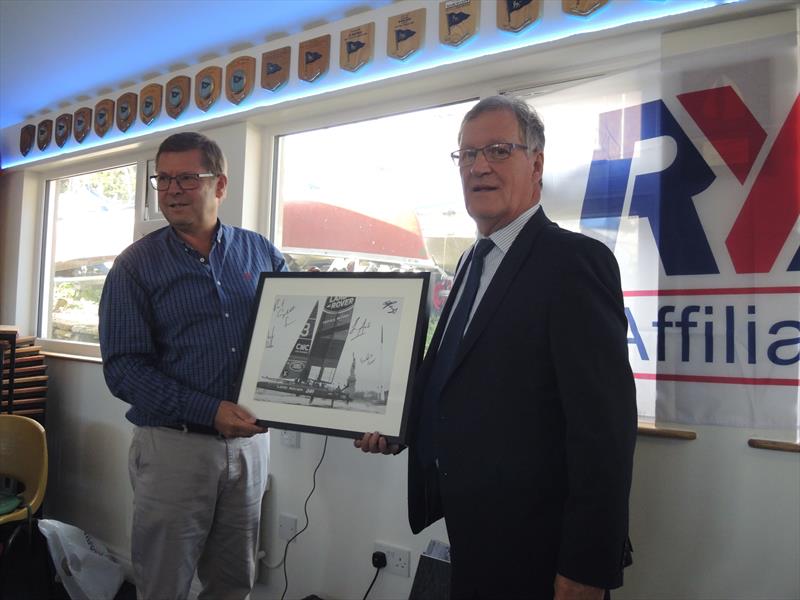 Joint Henri Lloyd CEO, Paul Strzelecki, presents Toddbrook SC Commodore, John Swales with a photo signed by Sir Ben Ainslie's America's Cup team photo copyright TSC taken at Toddbrook Sailing Club