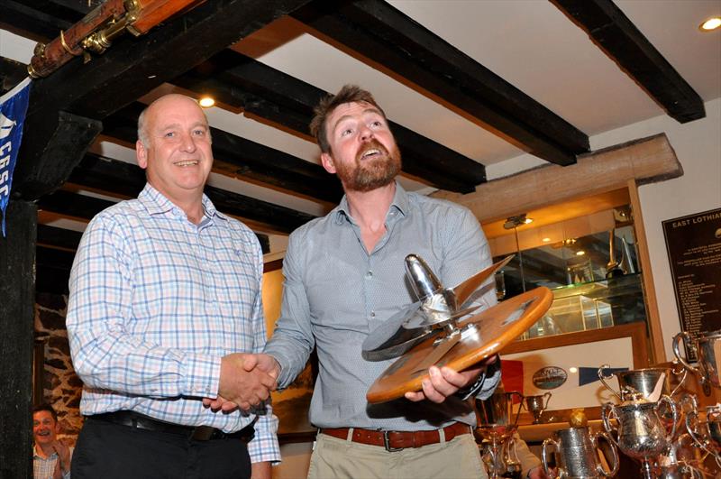 Donald MacKinnon was presented with the ‘Kestrel Propeller for Outstanding Service to the Club' by Robbie Lawson, Commodore at the East Lothian Yacht Club Prize Giving photo copyright David Farmer taken at East Lothian Yacht Club