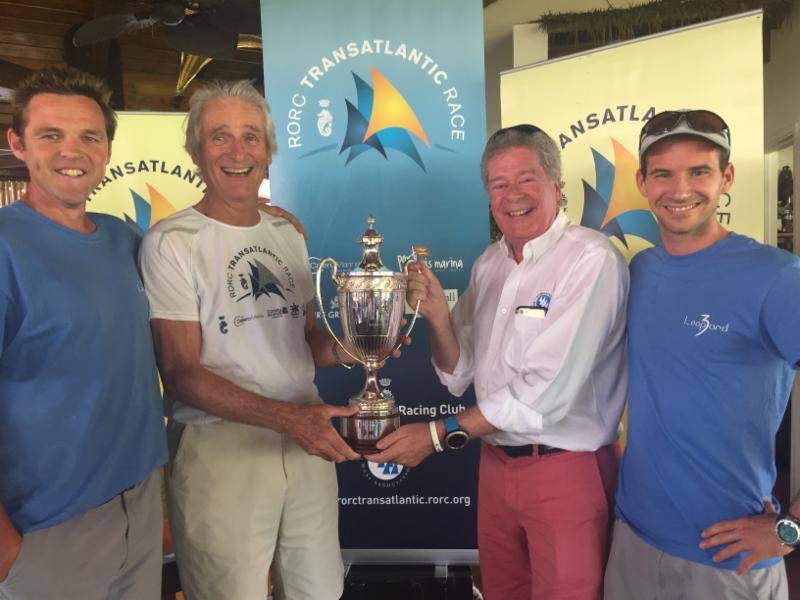 Mike Slade receives the International Maxi Association Trophy for monohull line honours from Andrew McIrvine, Secretary General of the IMA   RORC Admiral. The British Maxi was also third overall after time correction - photo © RORC / Arthur Daniel