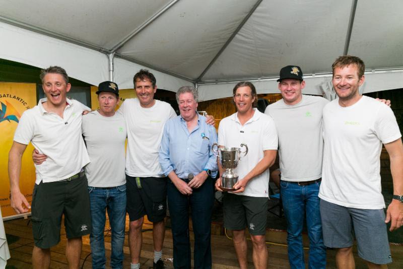 RORC Admiral, Andrew McIrvine presented Brian Thompson and Phaedo3 crew with the Multihull Class Trophy on Lloyd Thornburg's MOD70 - photo © RORC / Arthur Daniel