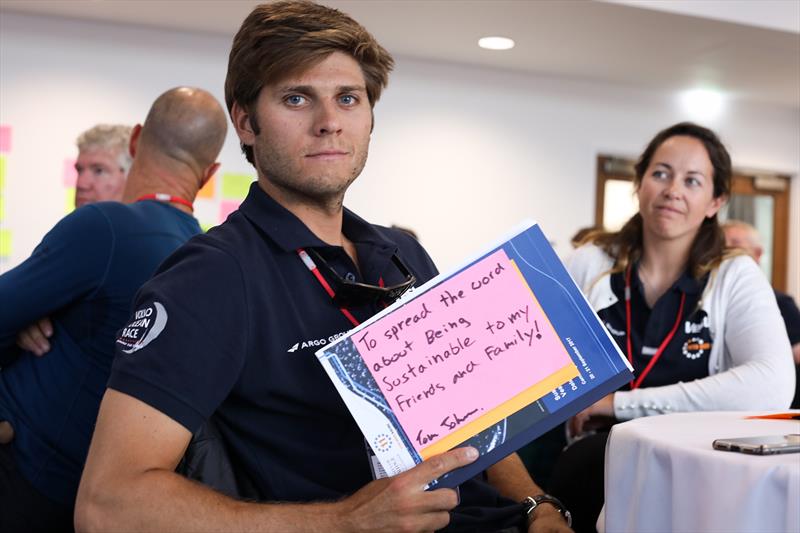 Tom Johnson make his pledge to protect the ocean, team member, Hannah Diamond looks on - photo © 11th Hour Racing