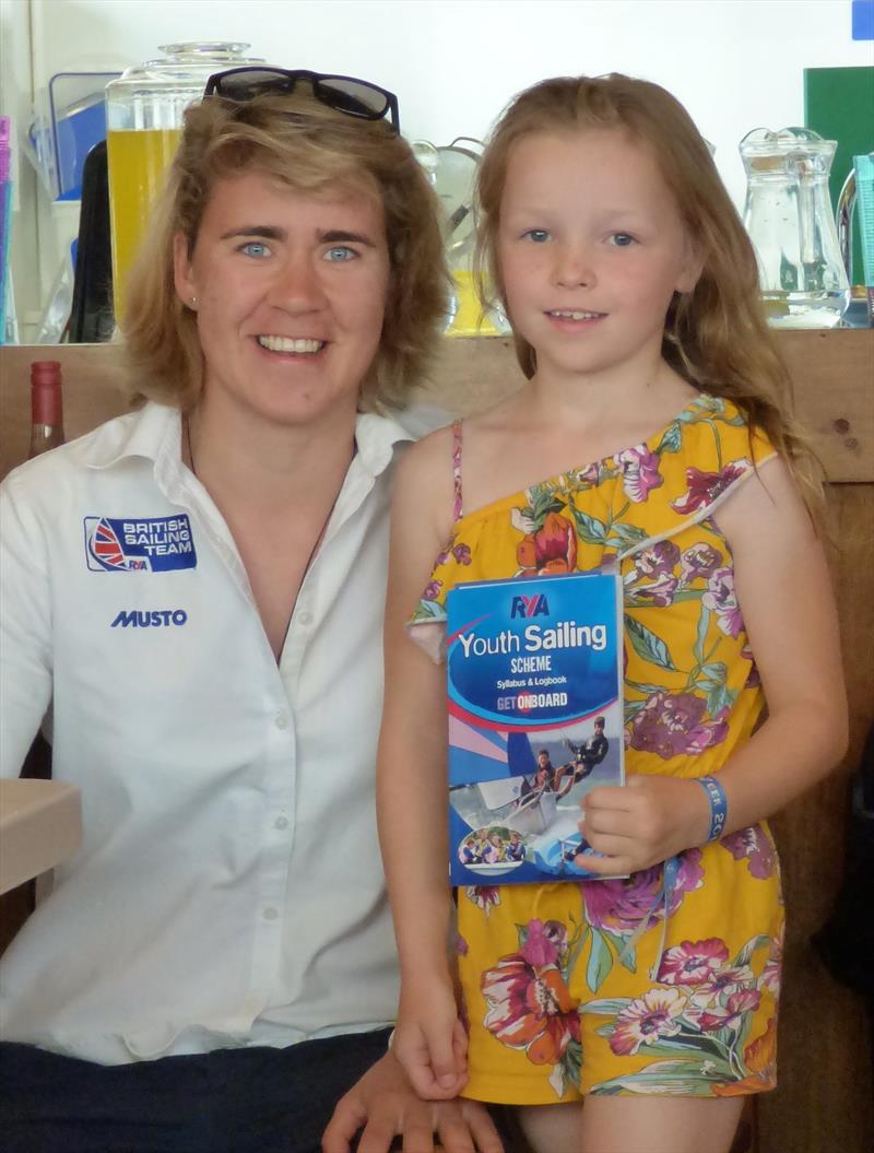 Lucy (age 8) presented with her Stage 1 certificated by former SYC Cadet, now Olympic squad member, Flora Stewart at Solway Yacht Club Cadet Week photo copyright Becky Davison taken at Solway Yacht Club