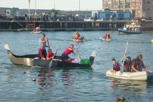 Fancy dress tender race across Weymouth Harbour during the 2018 Whyboats Weymouth Yacht Regatta photo copyright Kathy Claydon taken at Royal Dorset Yacht Club