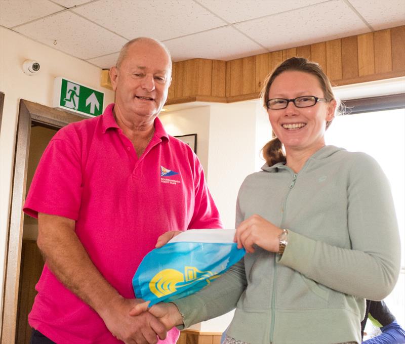 Takaza crew member Sapphire Thraves accepts 2nd place Pennant after Scarborough Yacht Club Autumn Series Race 7 photo copyright Chris Clark taken at Scarborough Yacht Club