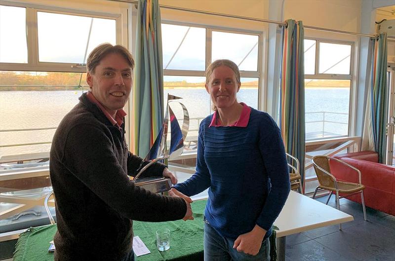 Ian Gregory receives the Frensham Frenzy trophy from Vice-Commodore Megan Pascoe photo copyright Clive Eplett taken at Frensham Pond Sailing Club