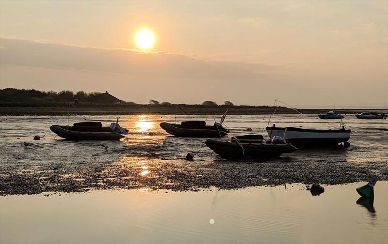 The Keyhaven YC rescue boats dry on their moorings at low tide over the Easter weekend photo copyright Mark Jardine taken at Keyhaven Yacht Club