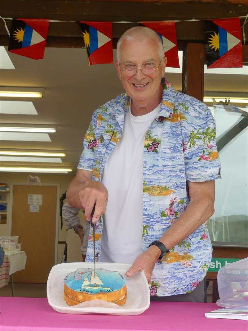 Commodore Norman Savigar cutting the 40th Anniversary cake during the SESCA Antigua Sailing Day Regatta photo copyright Mike Steele taken at St Edmundsbury Sailing & Canoeing Association