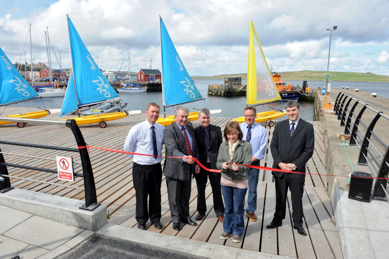 Kirsten Napier from Cunningsburgh (pictured front centre) cut a ribbon to formally open the new wooden boat deck at Lerwick Boating Club photo copyright Doug Allsop taken at Lerwick Boating Club