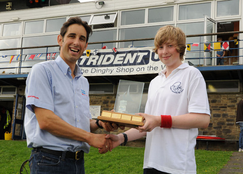 Dave Schilling (l) from Trident UK presents Simon Weatherspon with the RYA NE Youth Travellers Series winner's prize photo copyright Liz King taken at Derwent Reservoir Sailing Club