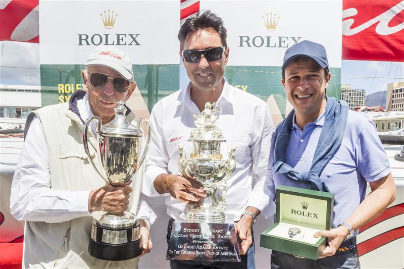 Bob Oatley, owner Wild Oats XI, skipper Mark Richards receive the Tattersall Cup and a Rolex Timepiece from Patrick Boutellier (Rolex Australia) photo copyright Carlo Borlenghi / Rolex taken at Cruising Yacht Club of Australia