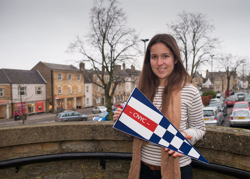 Graphic designer Chloe Taylor in Chipping Norton with her design of the yacht club's burgee photo copyright Trevor Taylor taken at Chipping Norton Yacht Club