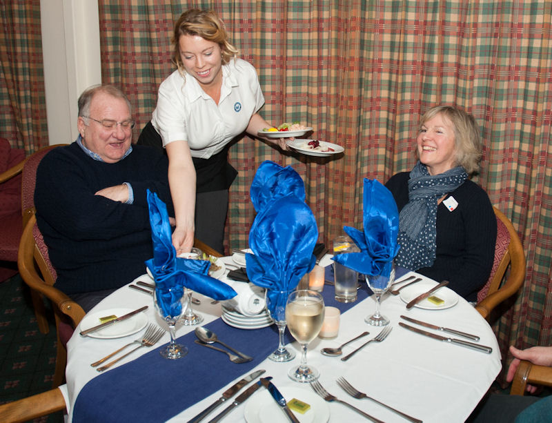 Catering manager Fiona Hirons serves Brian Collins and Jennifer Noble of Enstone at the Chipping Norton Yacht Club Inaugural Dinner held at the town’s golf club on Wednesday 30th January photo copyright CNYC taken at Chipping Norton Yacht Club