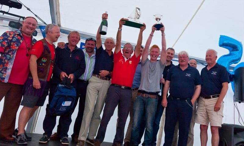 Aden Clark and the Blue Jade crew celebrate winning the 50th Carey Olsen Inter-Island Yacht Race photo copyright Sam Field Photography taken at Guernsey Yacht Club