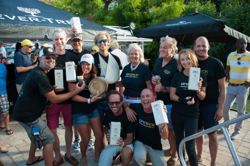OnDeck's Farr 65 crew on Spirit of Juno celebrate their win in CSA Racing 3 on English Harbour Race Day 1. Is that a few bottles and a 6-litre oak barrel of English Harbour Aged 5 Years Antigua Rum we see? - photo © Ted Martin