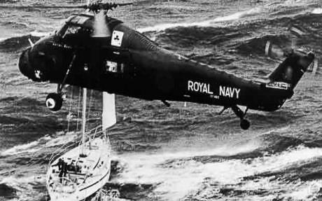 A Royal navy helicopter hovers above the yacht Camarague - 1979 Fastnet Race - PPL - Copyright reserved - photo copyright Royal Navy / PPL - Copyright reserved taken at Royal Ocean Racing Club