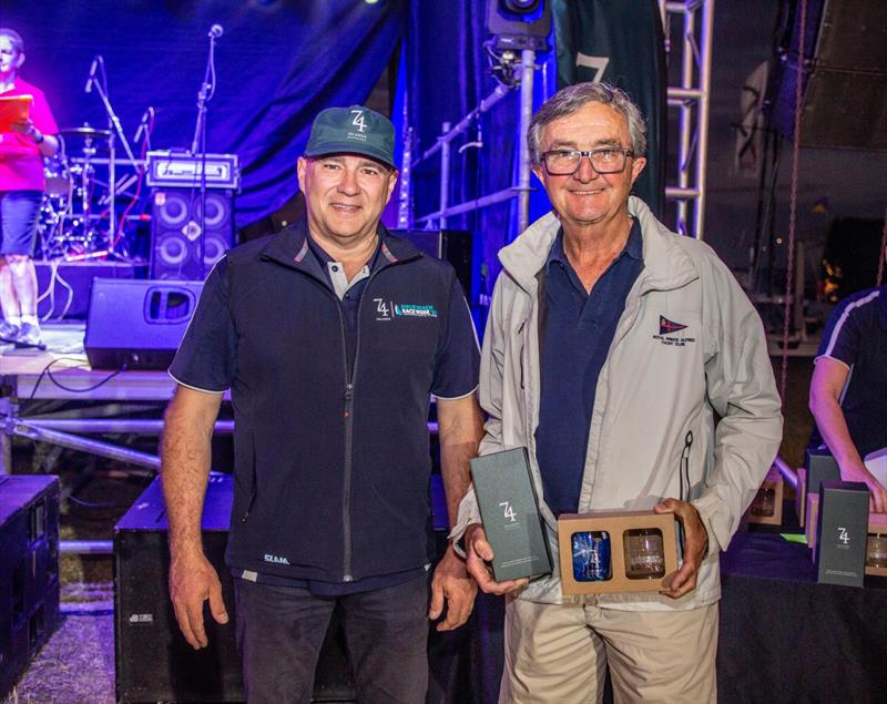 Richard Hudson of Antipodes happy with the 74 Islands Distillery prize last night - Islands Distillery Airlie Beach Race Week photo copyright Vampp Photography taken at Whitsunday Sailing Club