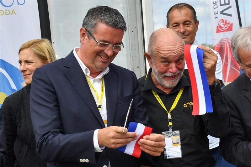 Yannick Moreau President of the Les Sables d'Olonne Agglomeration shares samples of the ribbon cut to open the GGR Race Village with Don MacIntyre, Chairman of the Golden Globe Race photo copyright Christophe Favreau / PPL / GGR taken at 