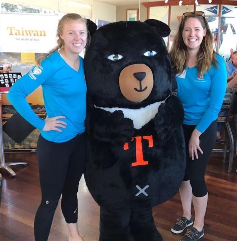 Adorable O'Bear was a popular party guest, here with Logan Ashcraft, left, and Collette Meyers, right - 2018 Red Bra Regatta - photo © Kara Hugglestone / Sail Couture