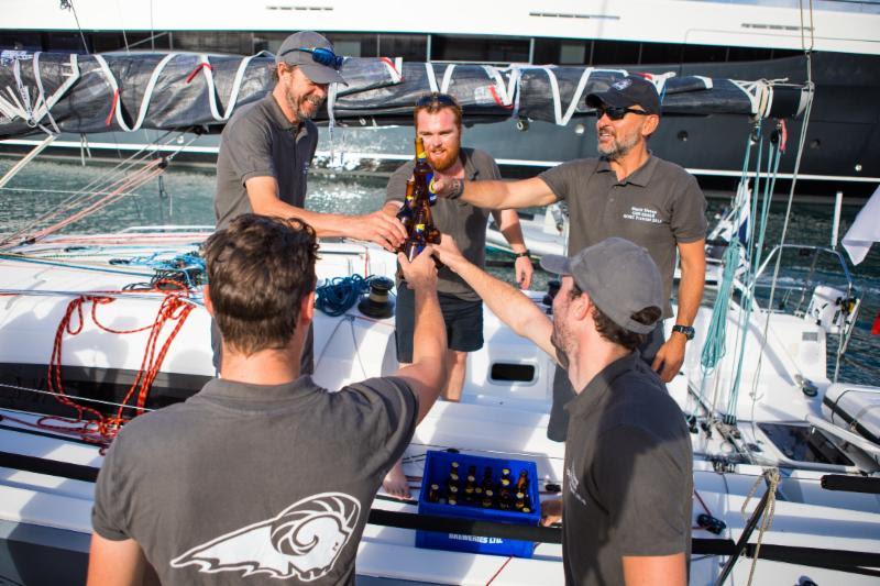 Enjoying ice cold beers on arrival, courtesy of C&N Port Louis Marina - 2018 RORC Transatlantic Race - photo © RORC / Arthur Daniel